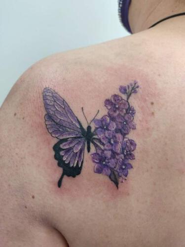 Butterfly with lilac. Picture taken from the Facebook group Discworld tattoos.